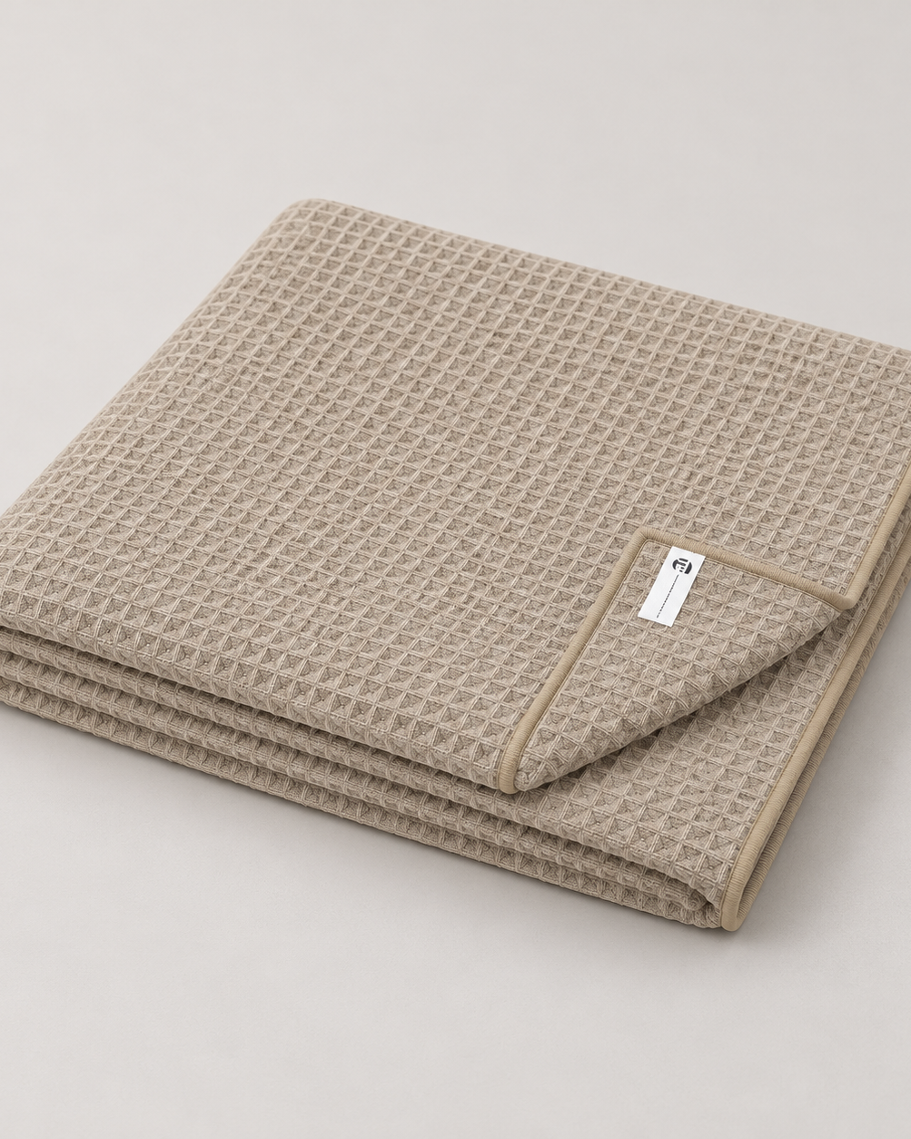 beige bath towel folded