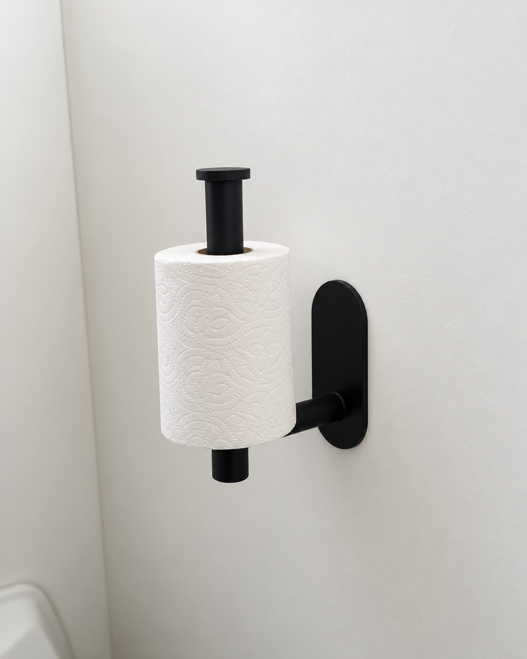 black toilet roll holder in use