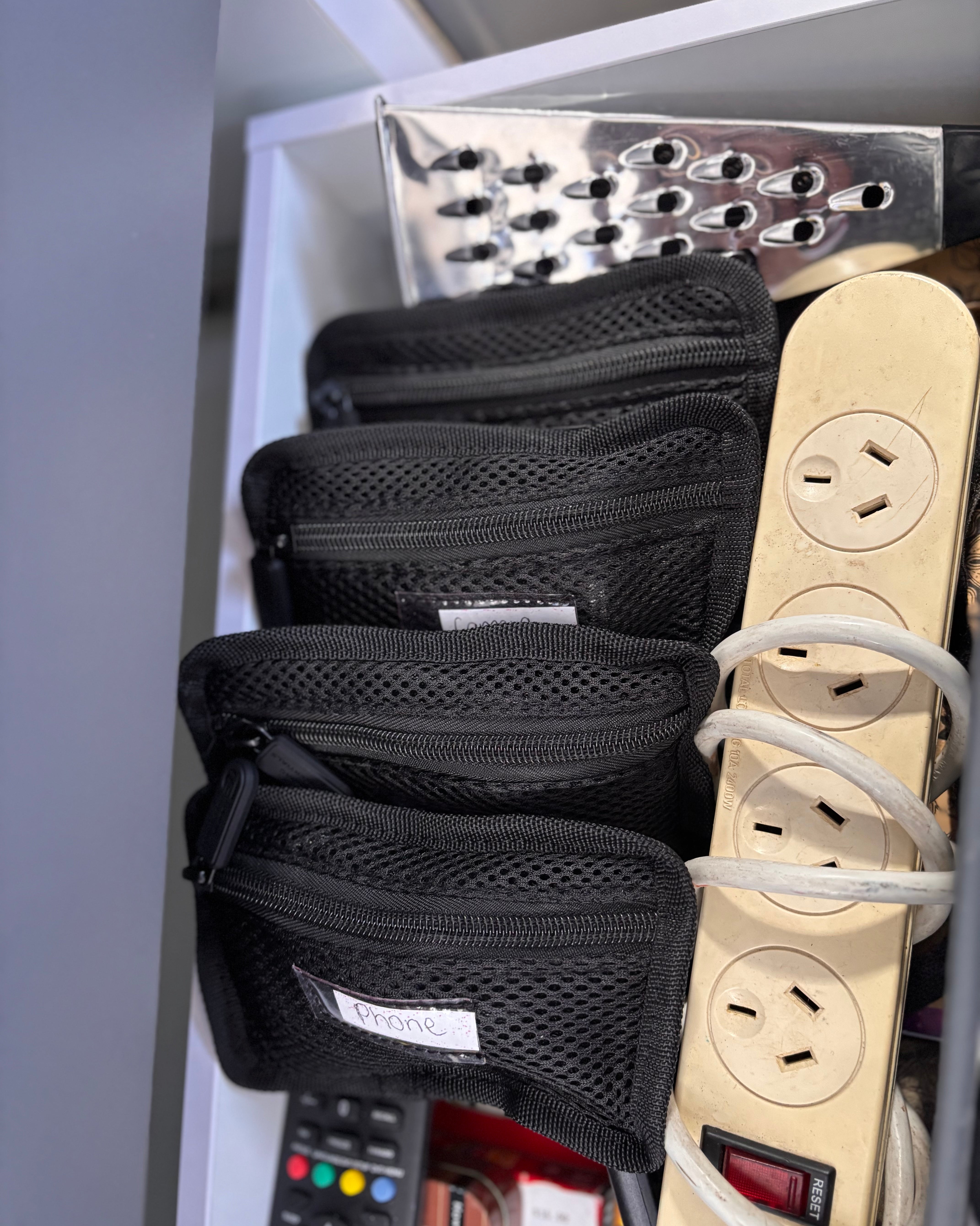 bags with phone and camera cords in them