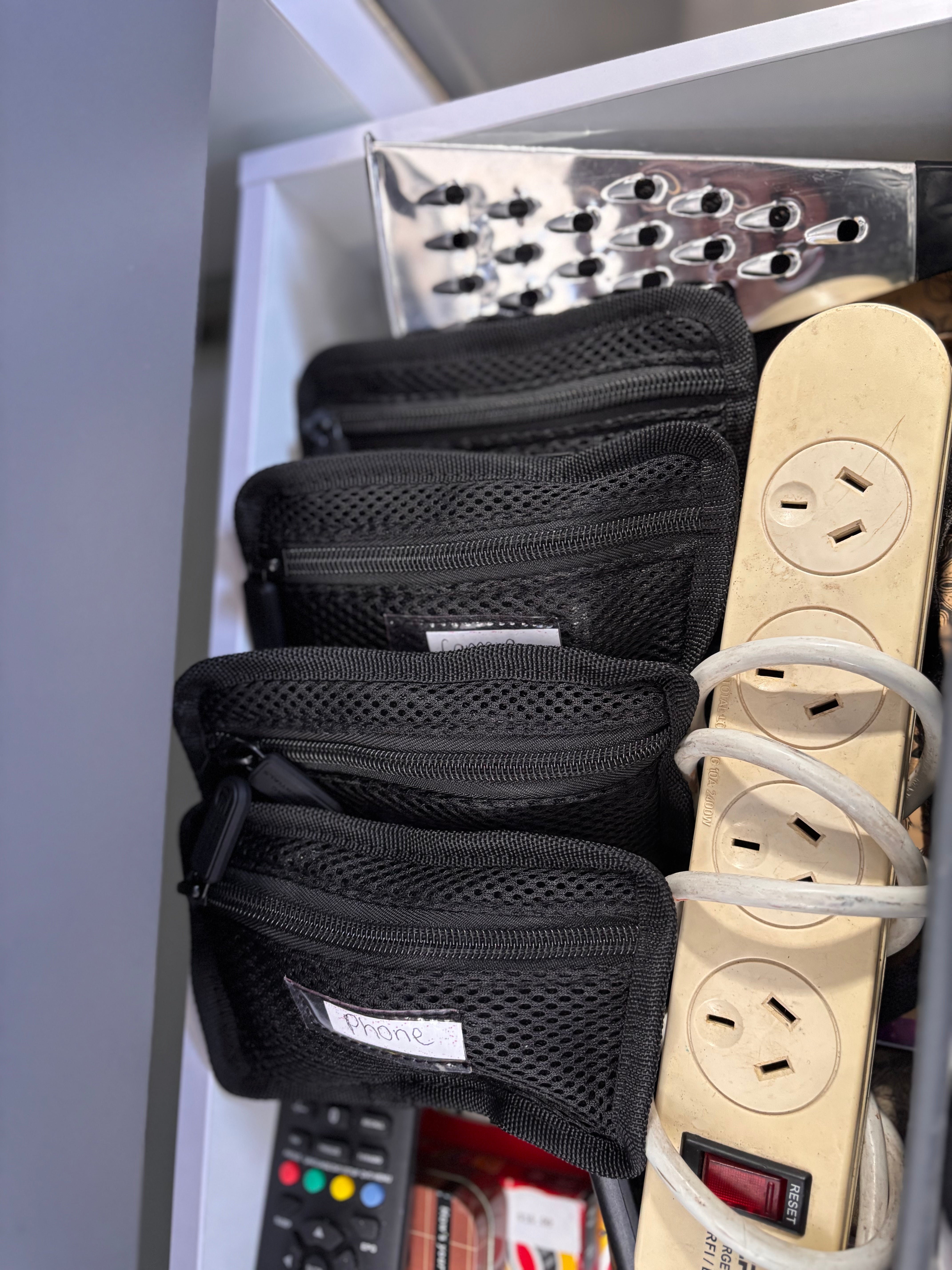 bags with phone and camera cords in them