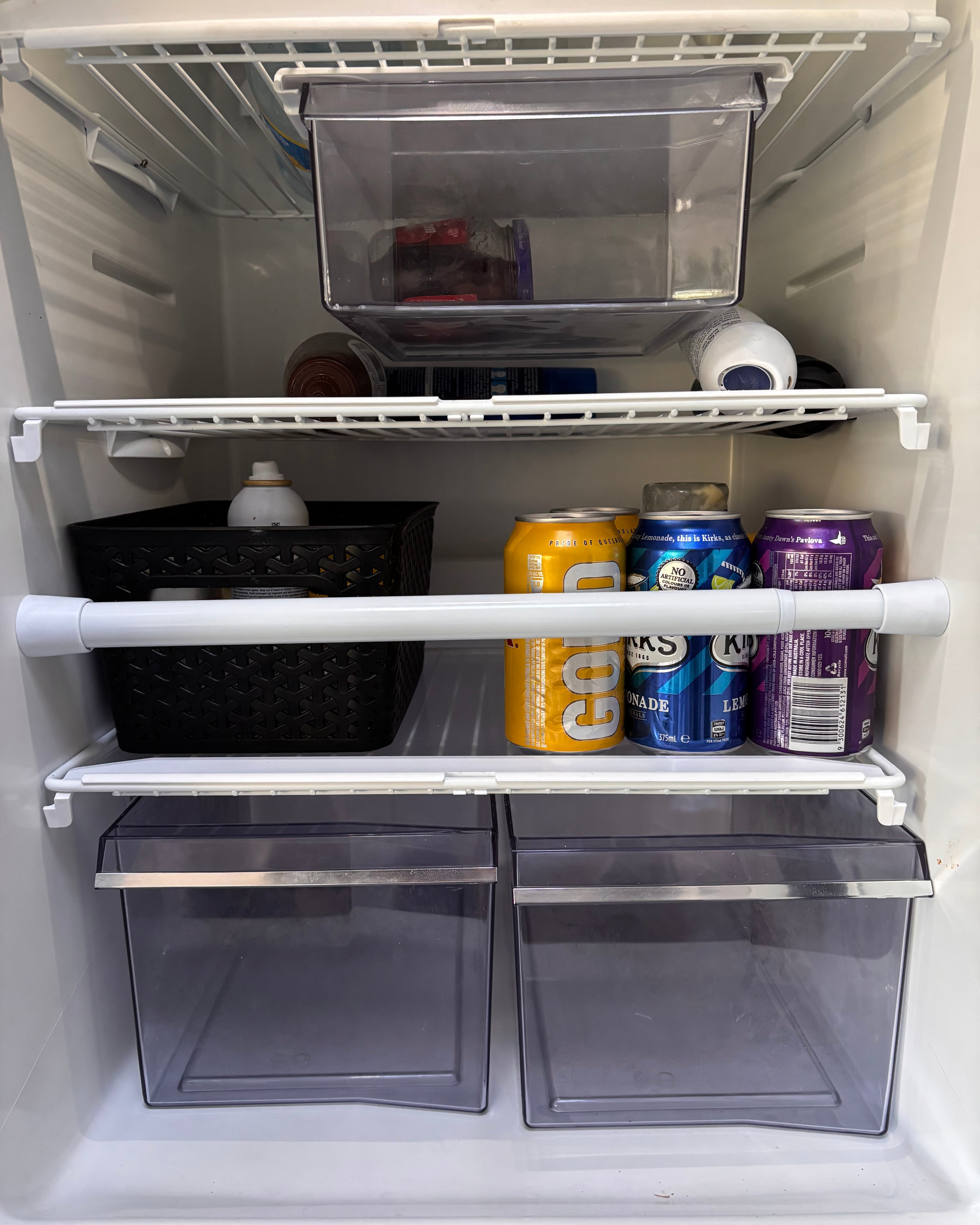 Open refrigerator with food and drinks on the shelves