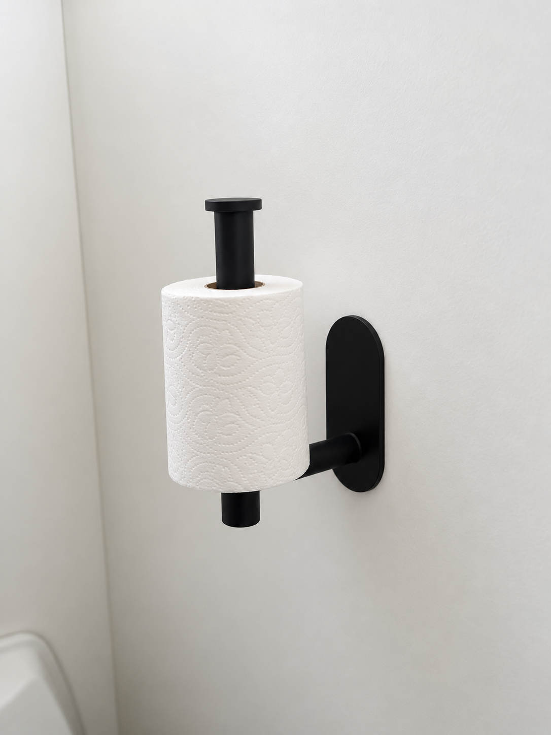 black toilet roll holder in use